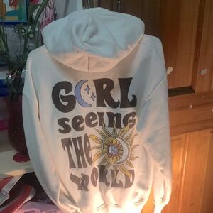 Beige hoodie size 13-14 , has cute designs on it